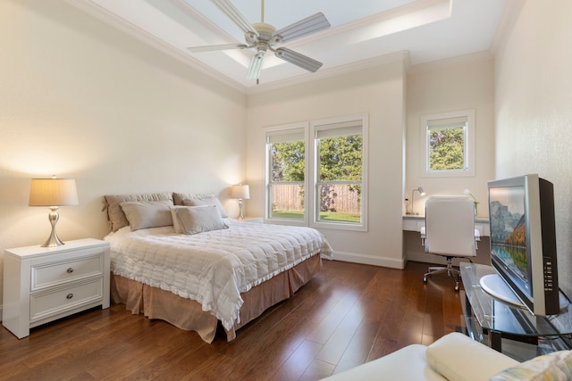 bedroom featuring dark hardwood / wood-style floors, ceiling fan, and ornamental molding