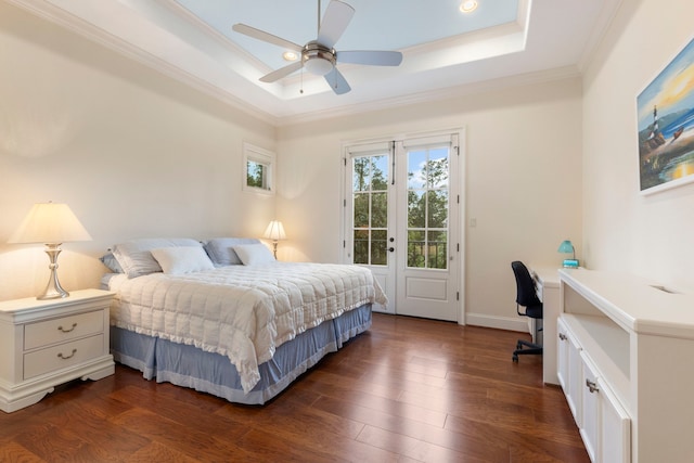 bedroom with access to exterior, ceiling fan, a raised ceiling, dark hardwood / wood-style floors, and crown molding