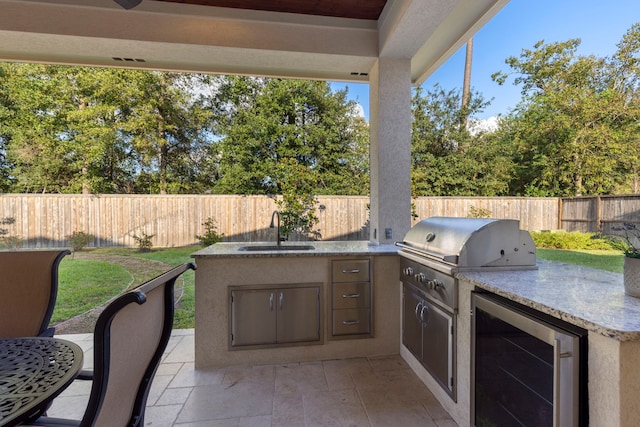 view of patio / terrace featuring area for grilling, sink, and grilling area