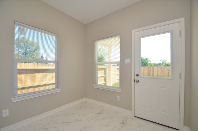 doorway to outside featuring a wealth of natural light