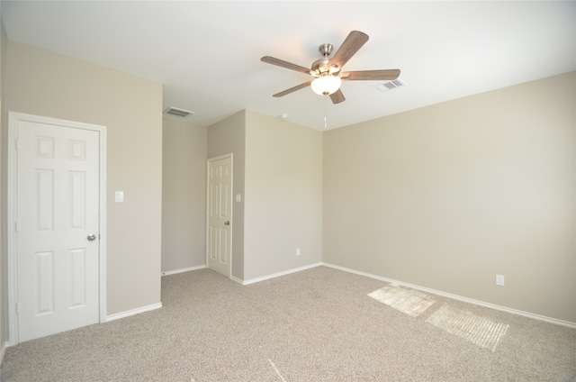 carpeted empty room with ceiling fan