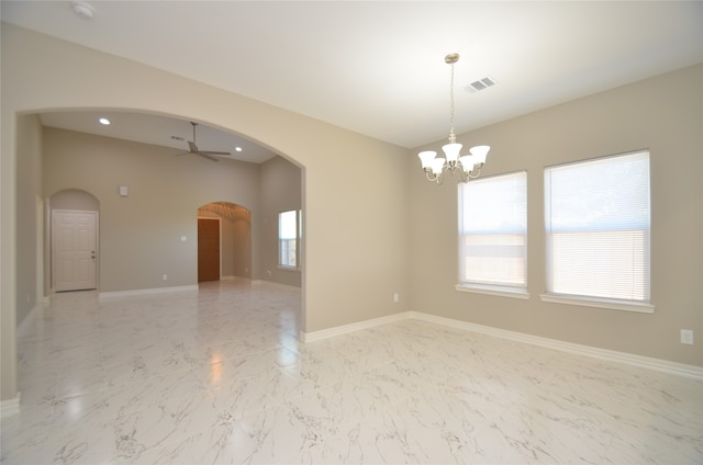 unfurnished room featuring ceiling fan with notable chandelier