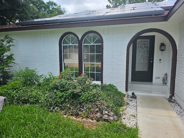 property entrance with solar panels