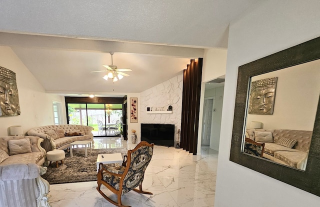 living room with a fireplace, a textured ceiling, vaulted ceiling, and ceiling fan