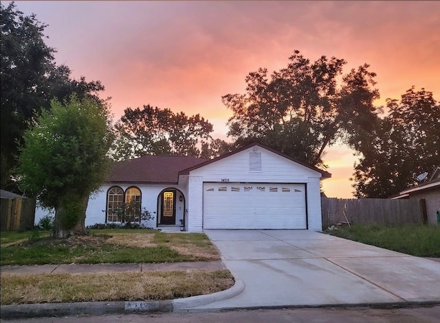 ranch-style house featuring a garage