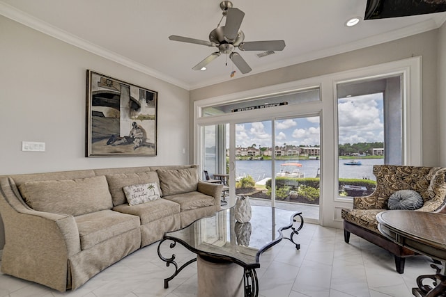 living room featuring ceiling fan, a water view, and crown molding