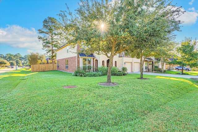 view of front facade with a garage and a front lawn