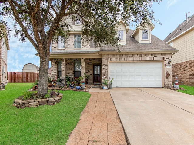 view of front of home featuring a garage and a front lawn