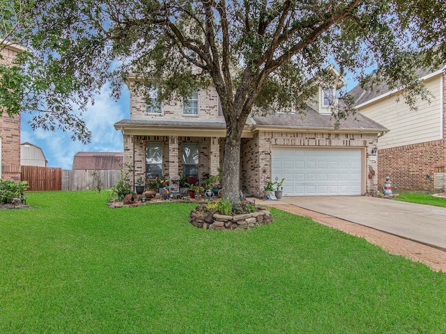 view of front of property featuring a garage and a front yard