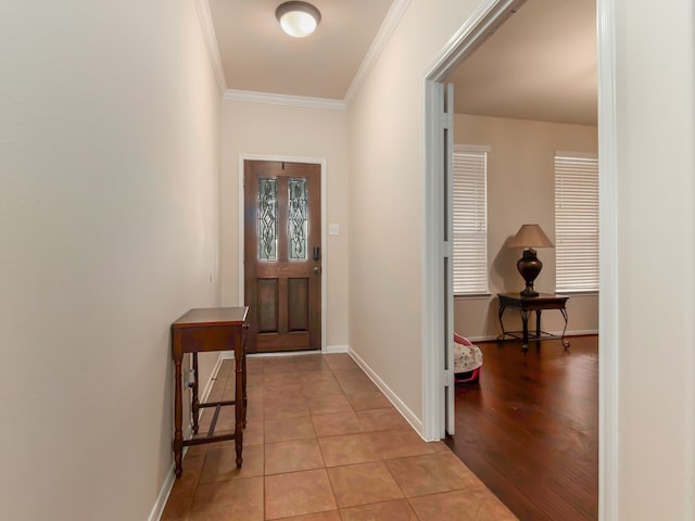 entryway featuring light wood-type flooring and ornamental molding