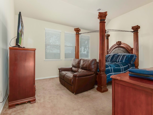 sitting room with light colored carpet and vaulted ceiling