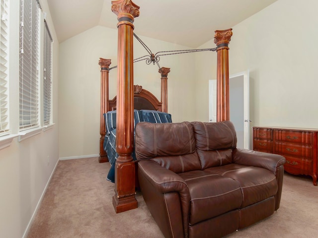 carpeted bedroom with vaulted ceiling