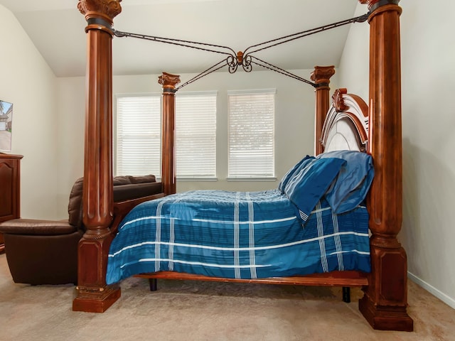 carpeted bedroom with vaulted ceiling