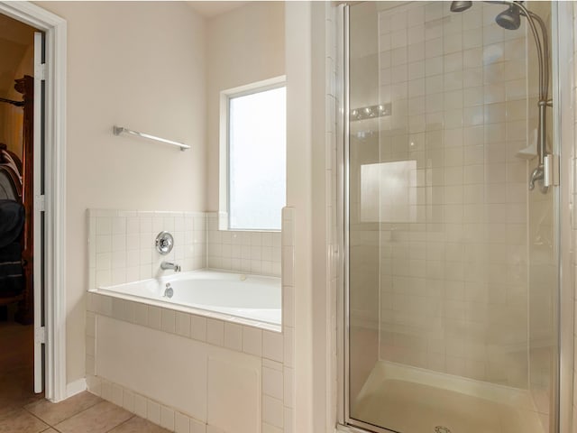 bathroom with tile patterned flooring and plus walk in shower