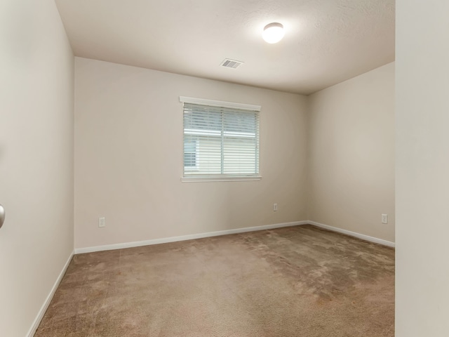 unfurnished room featuring carpet flooring