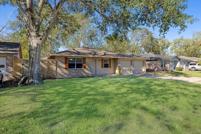 ranch-style house featuring a garage and a front lawn