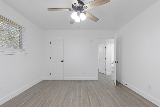 empty room featuring light hardwood / wood-style flooring and ceiling fan