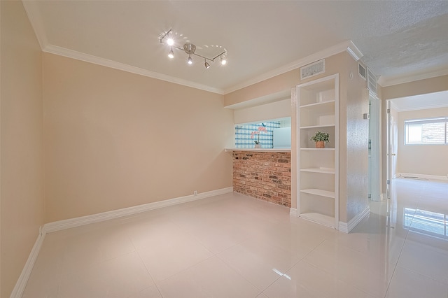 interior space featuring crown molding and tile patterned flooring