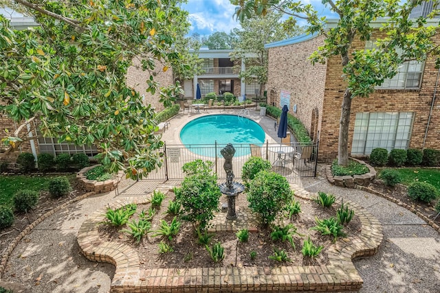 2121 Fountain View Dr Unit 22, Houston, TX 77057 - community pool featuring a patio area and a gate