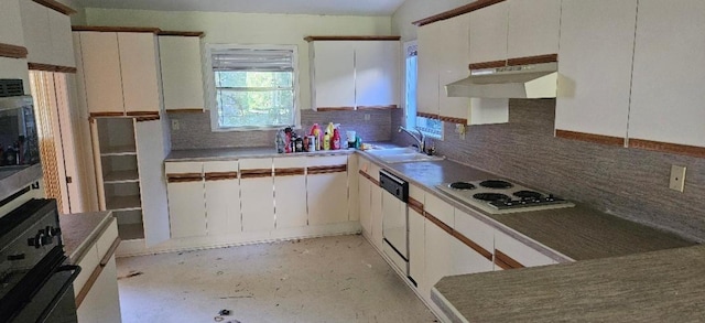 kitchen with white cabinets, decorative backsplash, white appliances, and sink