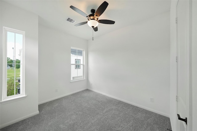 unfurnished room with carpet flooring and ceiling fan