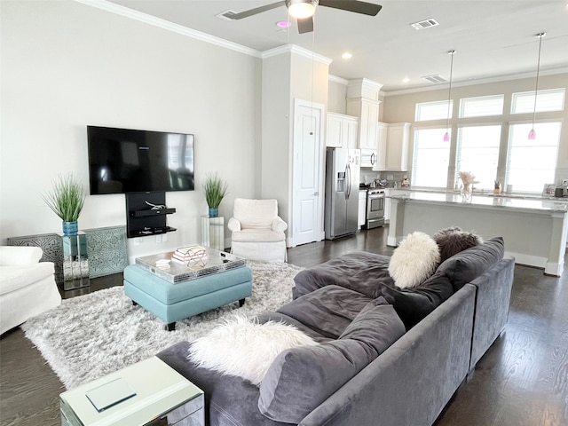 living room featuring crown molding, ceiling fan, and dark hardwood / wood-style floors