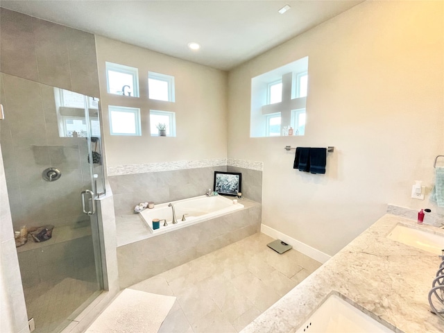 bathroom with vanity, plus walk in shower, and a healthy amount of sunlight