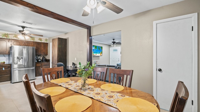 dining area with ceiling fan and light tile patterned flooring