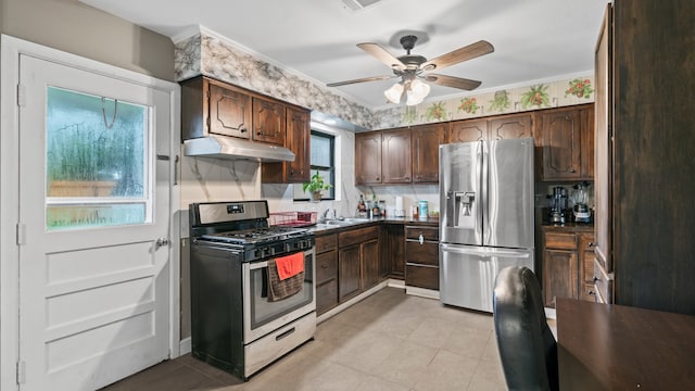 kitchen featuring dark brown cabinets, ceiling fan, ornamental molding, and appliances with stainless steel finishes