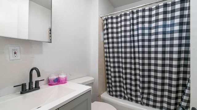 full bathroom with vanity, toilet, and shower / tub combo with curtain