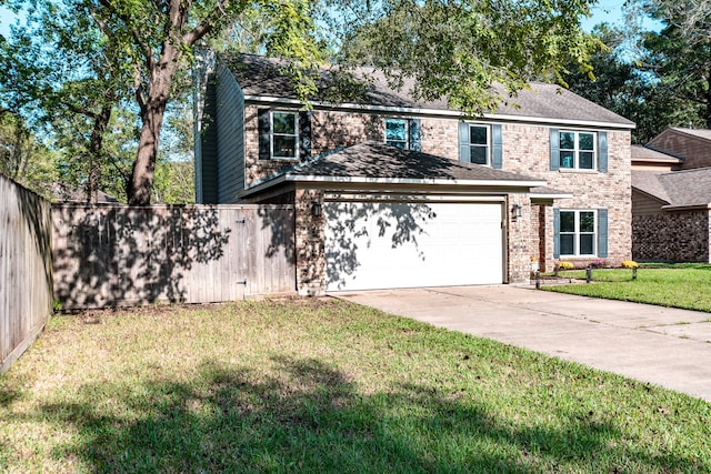 view of front of property with a garage and a front yard