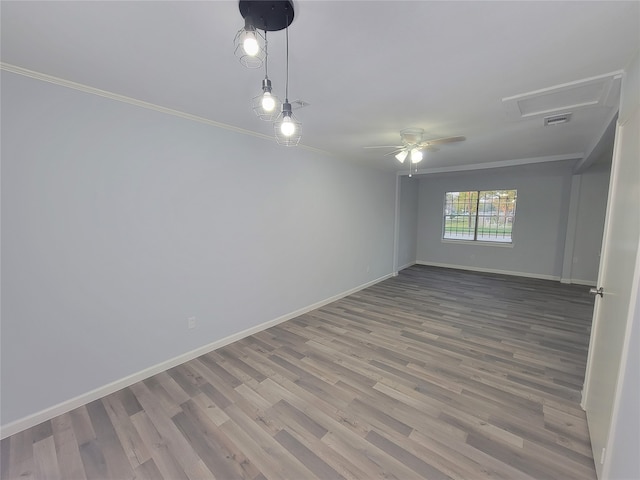 unfurnished room featuring crown molding, ceiling fan, and wood-type flooring