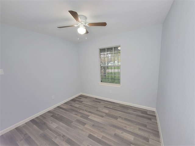 spare room with hardwood / wood-style flooring and ceiling fan