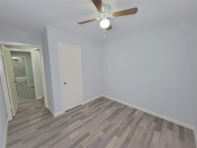 unfurnished bedroom with a closet, ceiling fan, and light hardwood / wood-style flooring