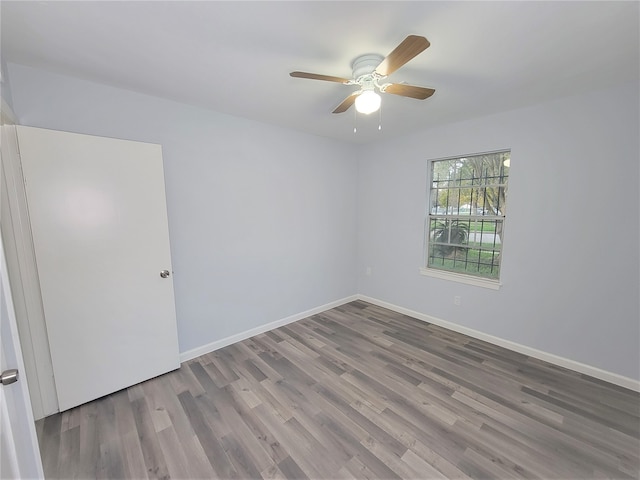 unfurnished room featuring hardwood / wood-style flooring and ceiling fan