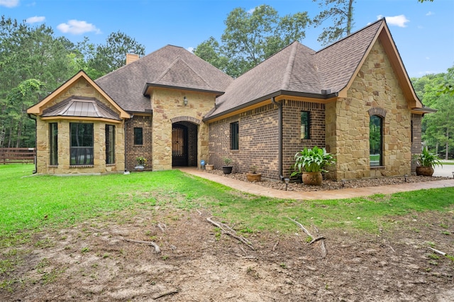 view of front of property with a front lawn