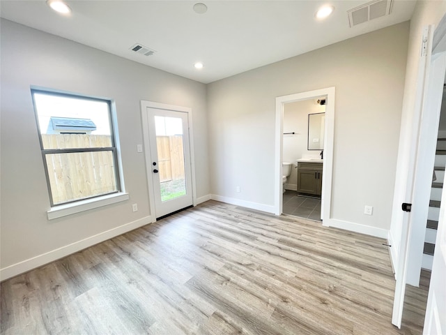 interior space featuring plenty of natural light and light hardwood / wood-style floors