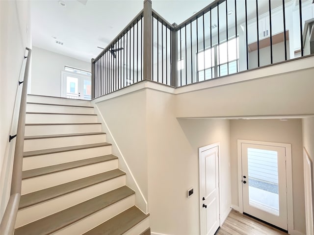 stairway featuring hardwood / wood-style floors