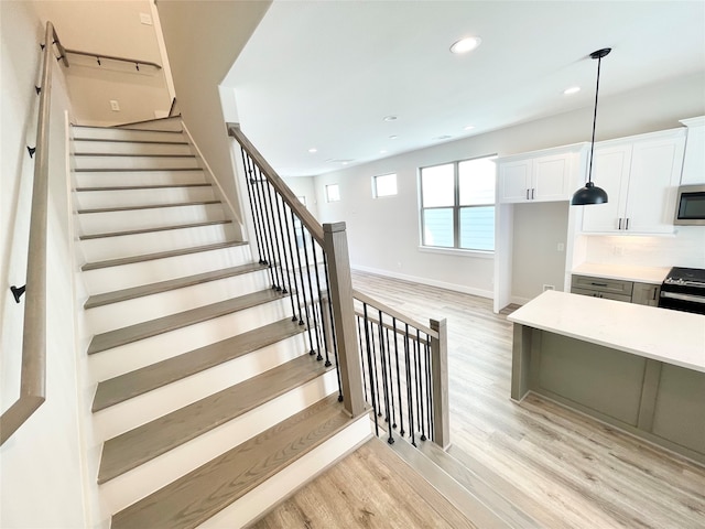 staircase featuring hardwood / wood-style floors