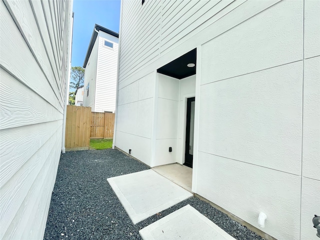 view of side of property with a patio