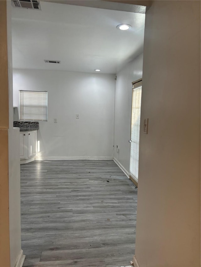 unfurnished room featuring wood-type flooring