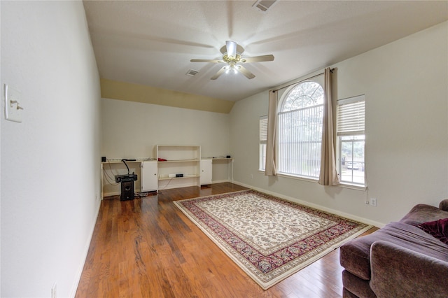 interior space with lofted ceiling, ceiling fan, and dark hardwood / wood-style floors