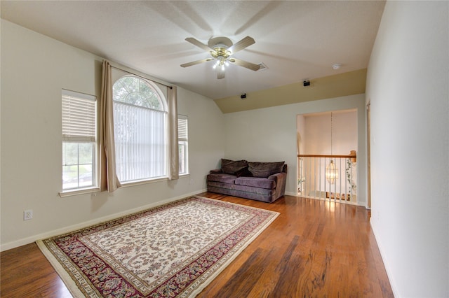 living area with hardwood / wood-style flooring and ceiling fan