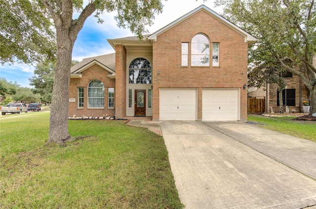 view of front of house featuring a front yard and a garage