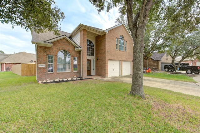 front facade featuring a front yard and a garage