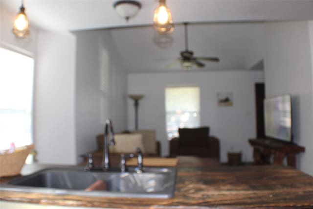 kitchen with ceiling fan, sink, and plenty of natural light