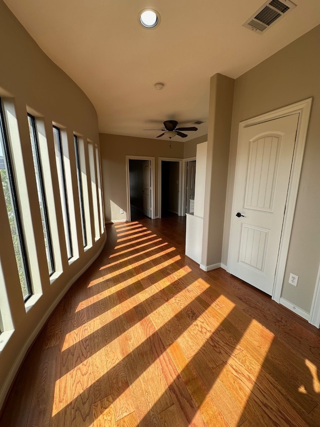 corridor featuring dark hardwood / wood-style flooring