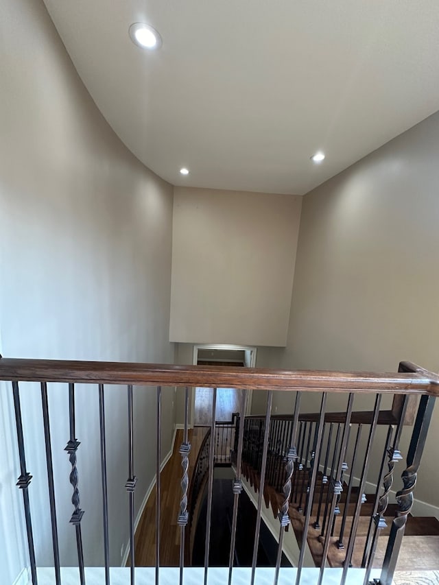 staircase featuring wood-type flooring