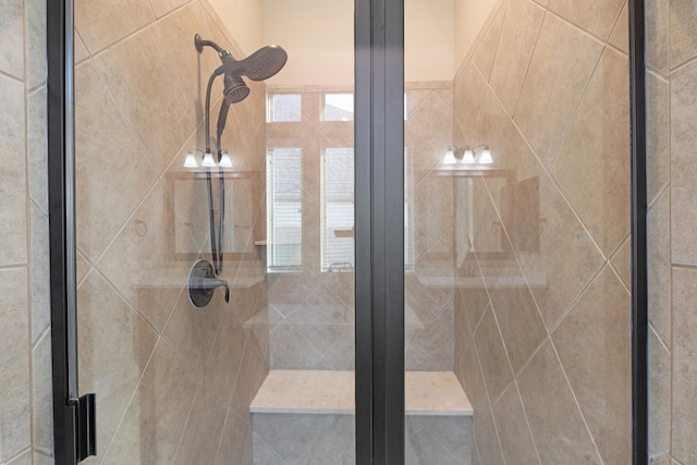 bathroom with a shower with shower door