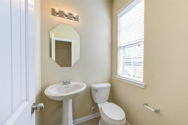 bathroom featuring sink and toilet